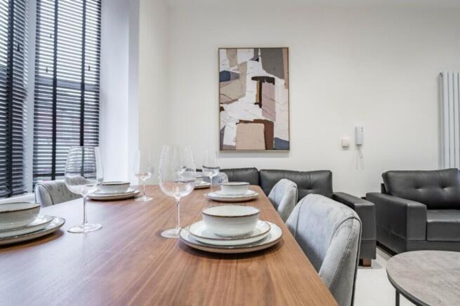 This stylish living room features a contemporar...
