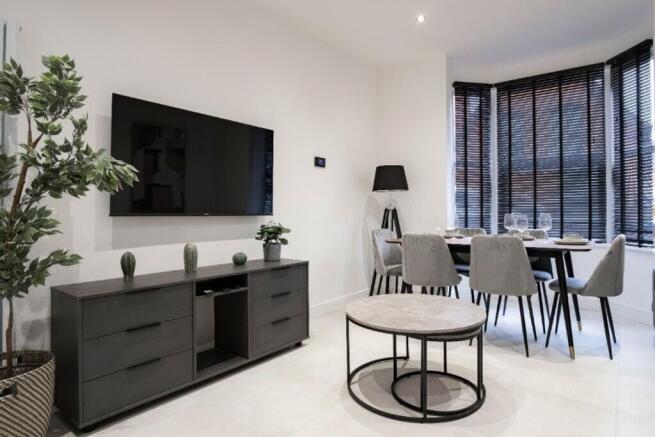 This stylish living room features contemporary ...