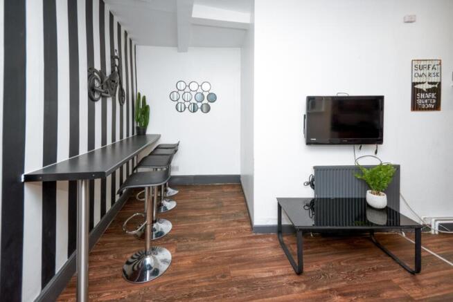 This vibrant communal lounge features stylish b...