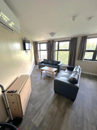 Bright and inviting living room featuring ample...