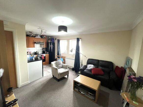 A cozy living room featuring a comfortable seat...