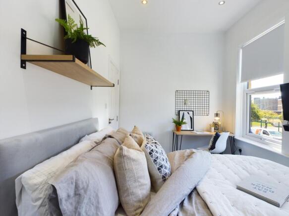 A spacious and inviting large double bedroom fi...