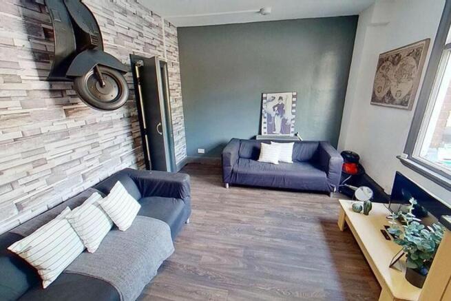 A stylish living room featuring comfortable sea...