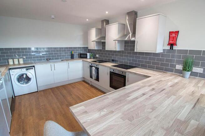 Modern kitchen featuring ample counter space, c...