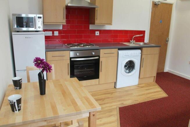 This modern kitchen features a stylish design w...