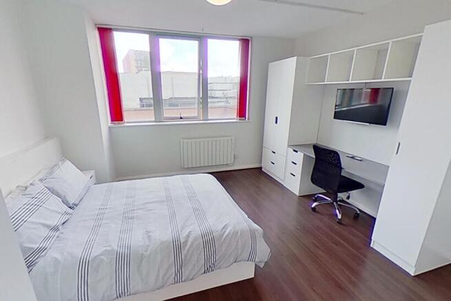 Bright and inviting double bedroom featuring a ...