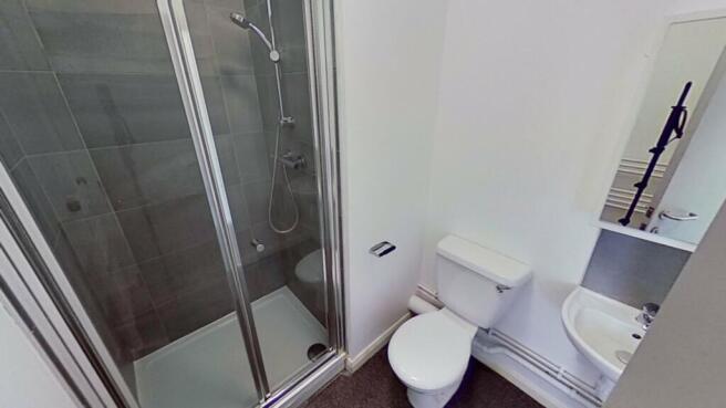A modern bathroom featuring a sleek shower, sty...