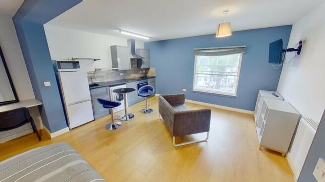 This inviting living area features modern furni...