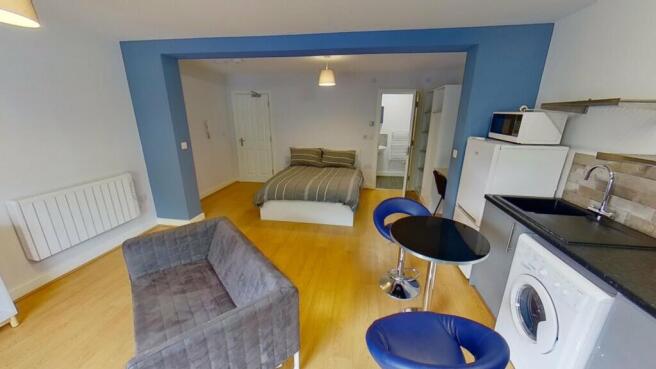 This modern double bedroom offers a spacious la...