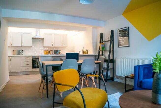 A bright and spacious modern living room featur...
