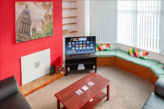 A bright and inviting living room featuring com...