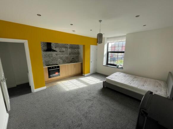 Spacious double bedroom featuring a vibrant acc...