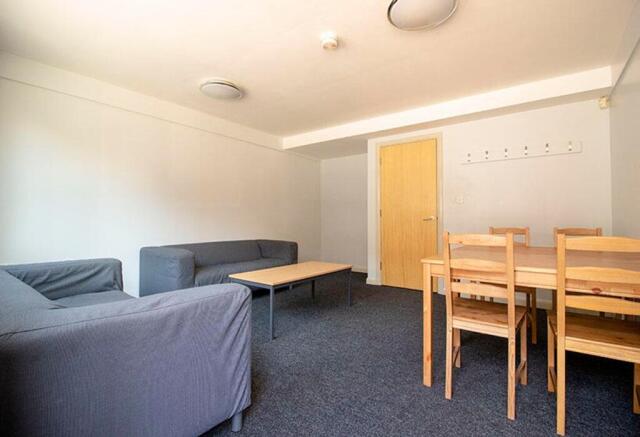 A spacious living room featuring comfortable se...
