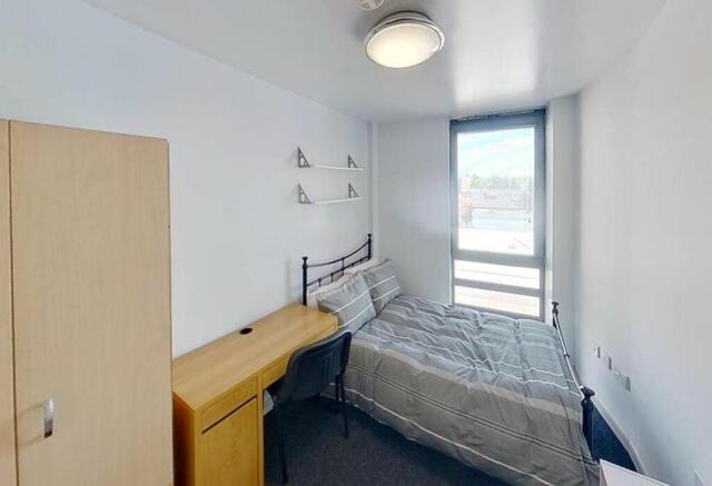 Bright and inviting double bedroom featuring a ...