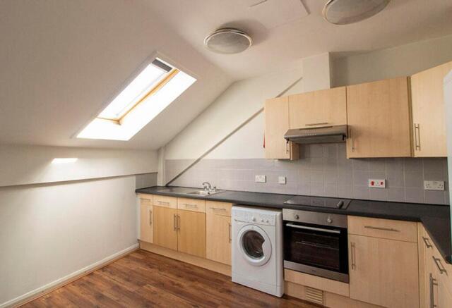 This modern kitchen features ample storage with...