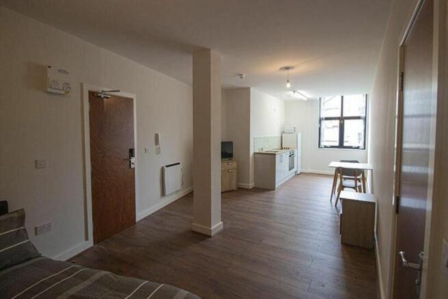 This spacious kitchen area features modern amen...