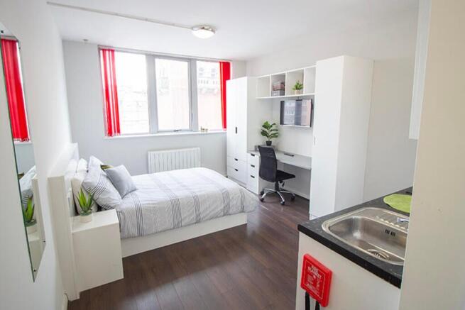 Bright and inviting double bedroom featuring a ...