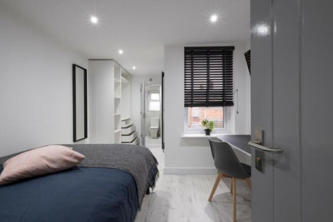 A beautifully designed double bedroom featuring...