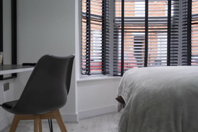 A cozy double bedroom featuring stylish decor, ...
