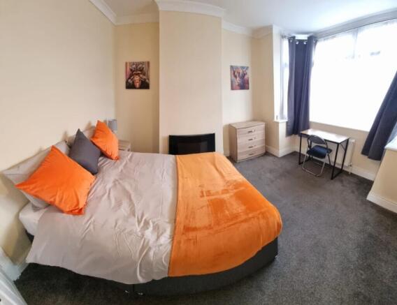 Bright and inviting double bedroom featuring a ...