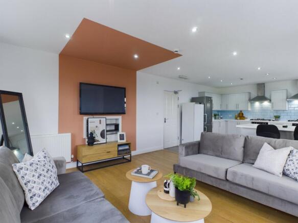 A spacious and inviting modern living room with...