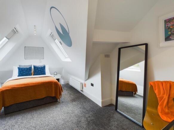 A spacious and stylish large double bedroom fea...
