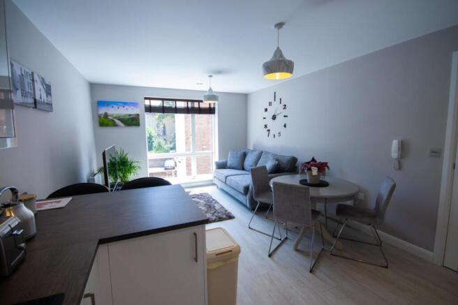 A spacious and modern living room with abundant...