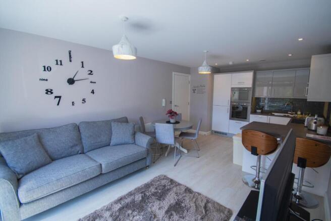 A spacious and stylish modern living room perfe...