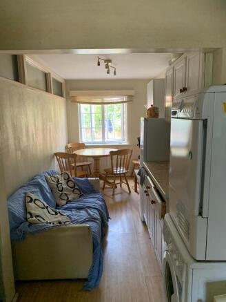 Bright and inviting kitchen space featuring amp...