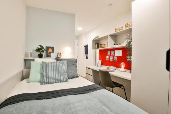 A beautifully designed double bedroom featuring...