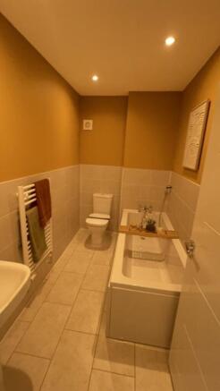 A stylish bathroom suite featuring a modern bat...