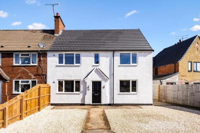A charming and well-maintained front view of a ...