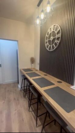 This stylish kitchen features a spacious counte...