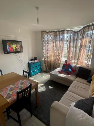 A bright and inviting living room featuring a c...