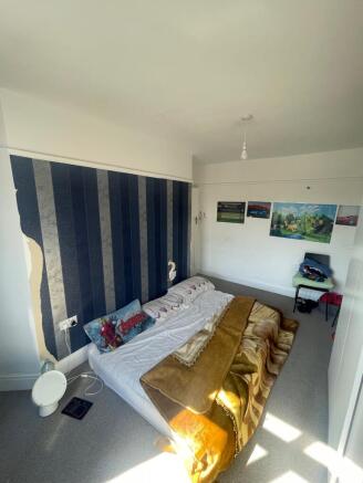 Spacious double bedroom featuring a cozy layout...