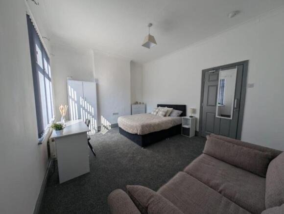 Bright and inviting double bedroom featuring a ...
