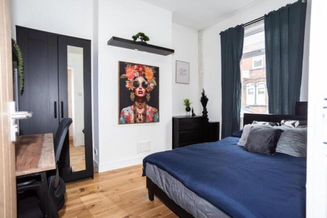A beautifully designed double bedroom featuring...