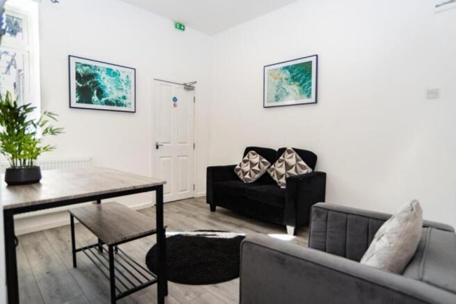 A bright and inviting living room featuring mod...
