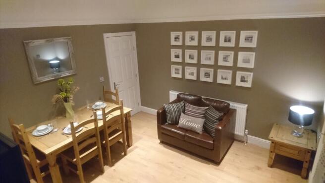 This inviting living room features a cozy seati...