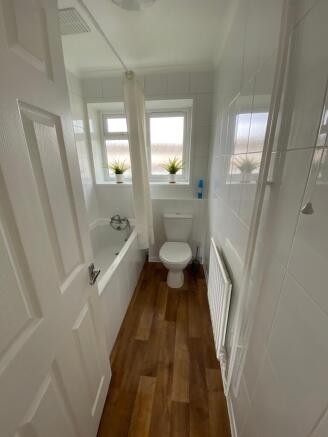 Bright and modern bathroom featuring a stylish ...