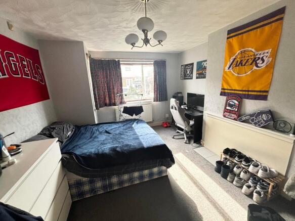 Spacious double bedroom featuring good natural ...