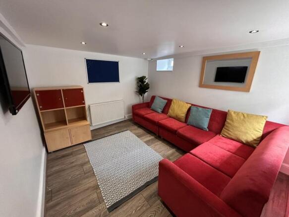 This inviting living room features a spacious r...