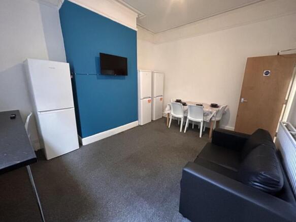 Spacious living area featuring a comfortable so...