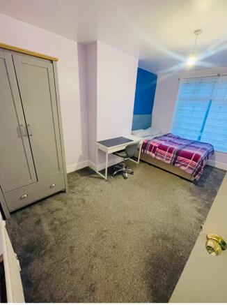 Bright and inviting double bedroom featuring a ...