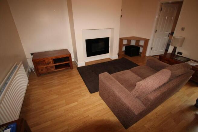 Cozy living room featuring a comfortable sofa, ...