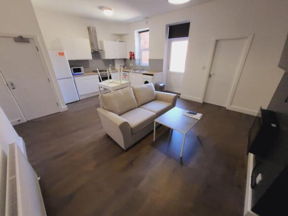 Spacious and inviting living room featuring mod...