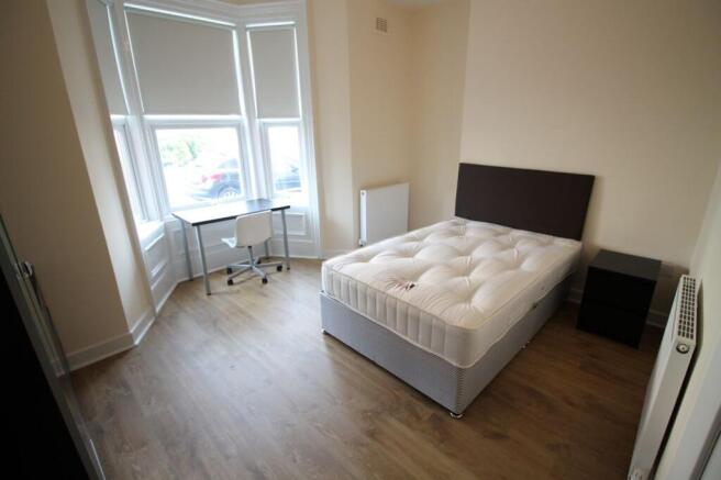 This bright and inviting double bedroom feature...