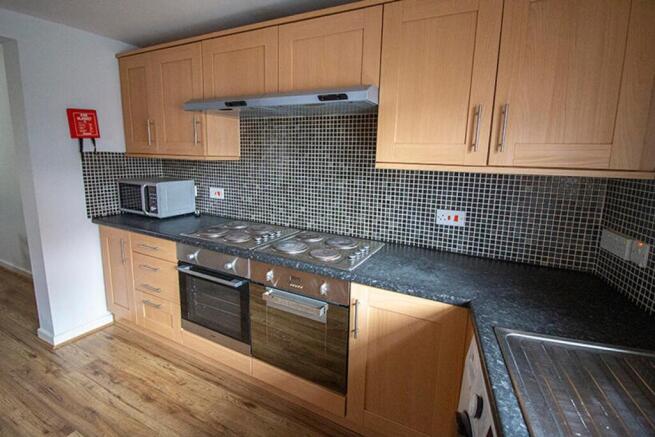 This modern kitchen features ample storage with...