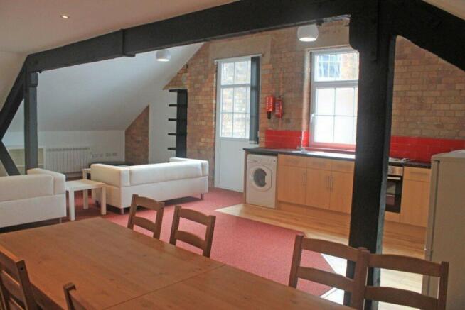 Spacious and inviting living room area featurin...