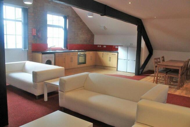 Spacious and inviting living room featuring mod...